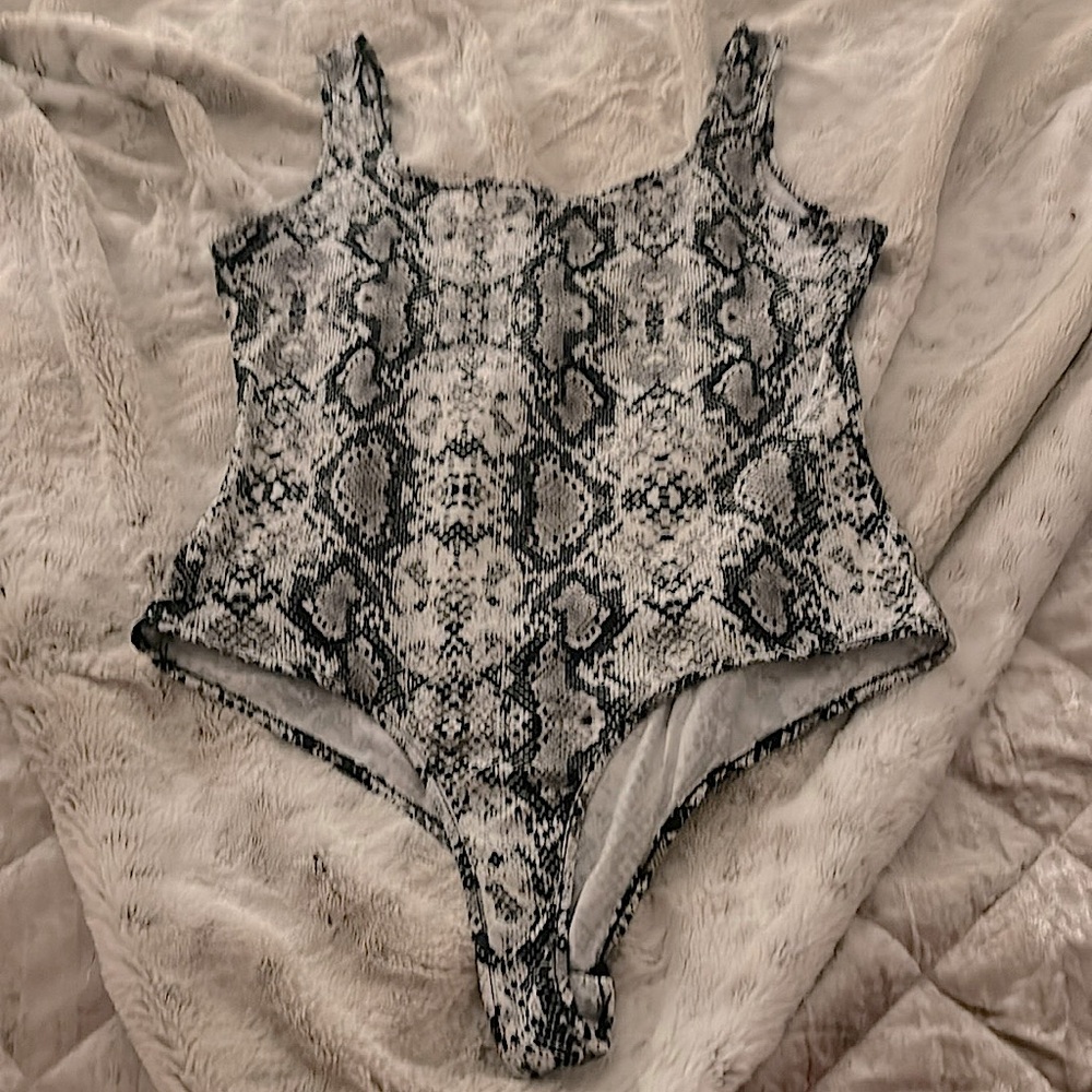 Beautiful soft body suit with snappy crotch fastening never worn size L